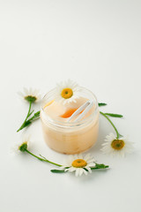 Plant-based beauty products. Eyes pads with herbal extract, camomile flowers, concept of organic plant cosmetics product.