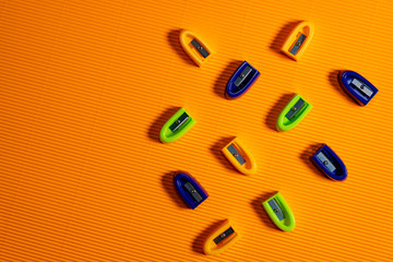 education equipment on orange background.