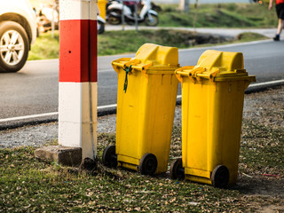 Fototapeta na wymiar View of two yellow garbages box on the road side.