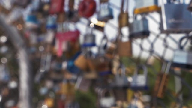This video is about a slow motion view of love locks on fence. This video was filmed in 4k for best image quality.