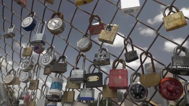 This video is about a slow motion view of love locks on fence. This video was filmed in 4k for best image quality.