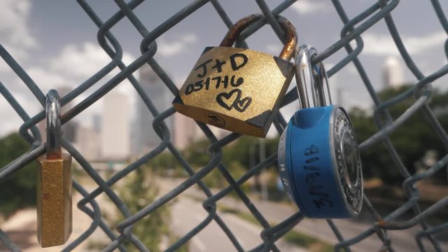 This video is about a slow motion view of love locks on fence. This video was filmed in 4k for best image quality.