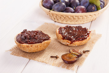 Sandwiches with plum marmalade or jam on jute burlap, breakfast concept