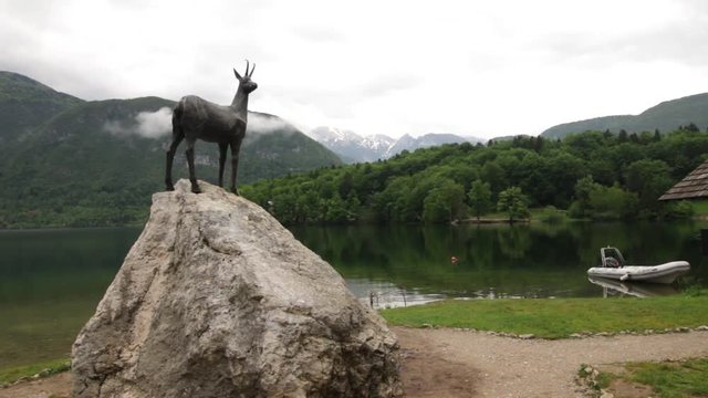 View over lake bohink and the massive Tosc and Triglav mountains.
