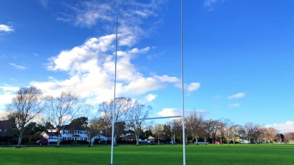 Rugby goalposts against a blue Sky - Powered by Adobe
