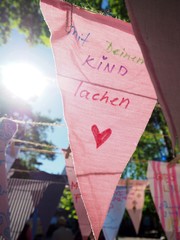 Colorful flags decorate the streets in Cologne, Germany at the day of good life in the Agnes...