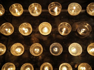 Candels in a church close up with dark background