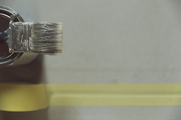 Painting tools for wooden board. Brush, coloring tape and construction knife