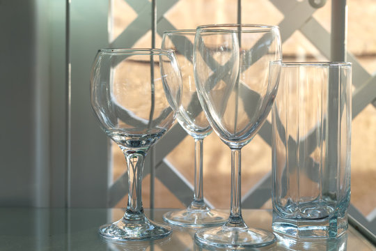 Empty glasses are on the glass shelf