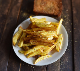 French fries on a white plate fried bread