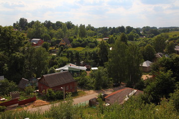 Russia, Mozhaisk - panoramic view from the observation deck of the Mozhaisk Kremlin on Borodino street in sunny summer day against the blue sky with clouds