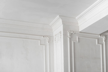 unfinished plaster molding on the ceiling and columns. decorative gypsum finish. plasterboard and painting works - obrazy, fototapety, plakaty