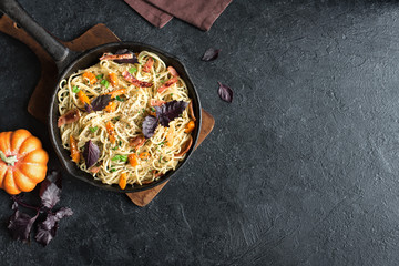 Spaghetti pasta with pumpkin and bacon