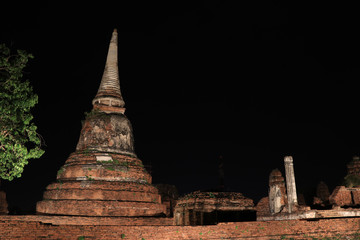 Night shot of incomplete small stupa in the ruins of ancient remains at Wat Mahathat temple, it...