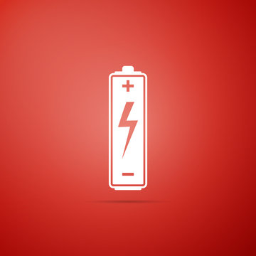 Battery icon isolated on red background. Flat design. Vector Illustration