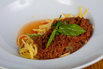 Pasta Bolognese with basil