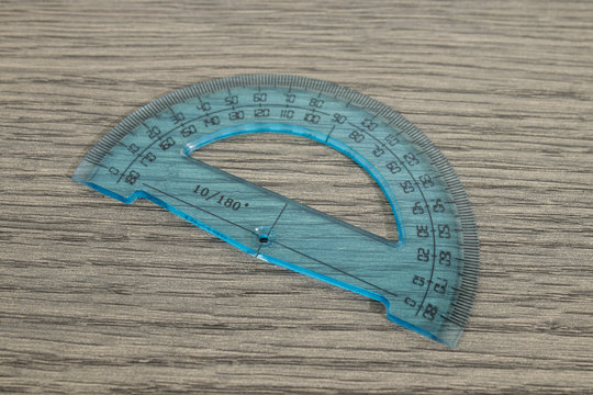 Stationery, Blue Goniometer On A Wood Table