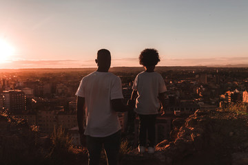 Rear view of father and son looking at view 