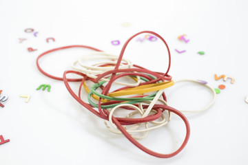 Stationery products, many colored rubber bands isolated in a white background