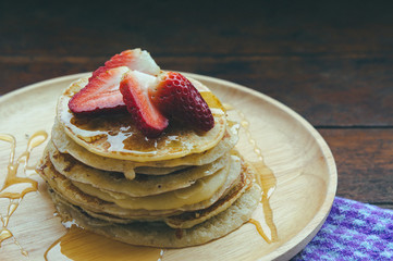 pan cake dessert and honey strawberry fruit on wood dish , tasty sweet dessert