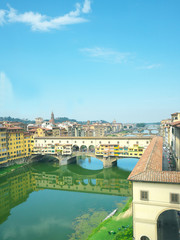 Florence,Italy-July 26,2018: Famous bridge Ponte Vecchio on the river Arno in Florence, Italy.
