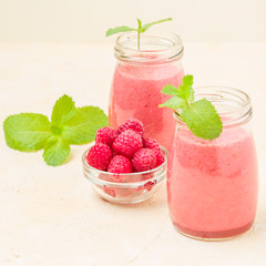 Raspberry smoothie close up photography with fresh summer blended cocktail and ripe berries.
