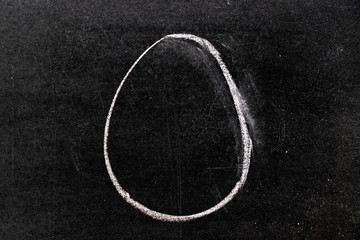White chalk hand drawing in oval shape on blackboard background