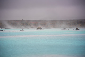 The Blue Lagoon geothermal spa and lava rocks in Iceland.