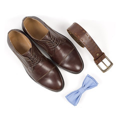 Isolated stylish leather men's dress shoes and accessories