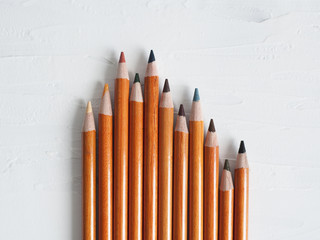 Collor wooden pencils on white background.