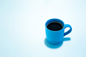 blue coffee cup against white background