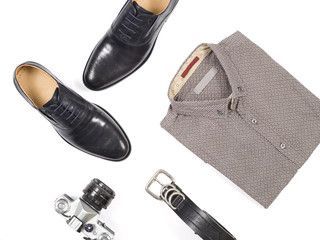 Close up of modern man accessories. bow tie, leather shoes, belt on white background.