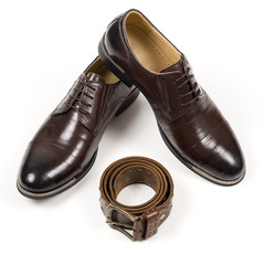 Isolated stylish leather men's dress shoes and accessories
