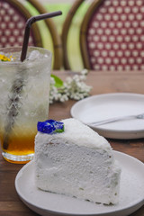 coconut cake dessert on wood table , tasty cake