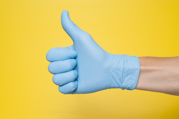 Doctor Wearing Blue Latex Glove Giving Thumbs Up Sign