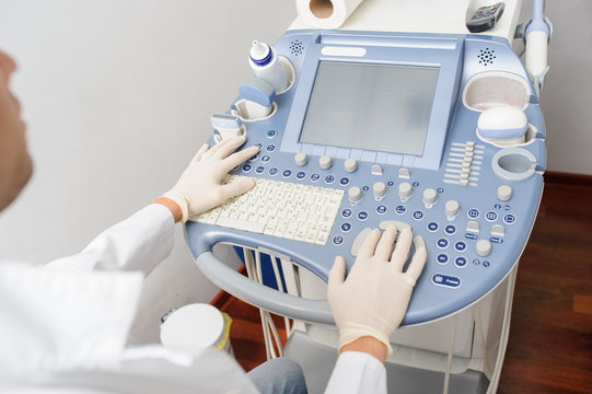 The doctor using the ultrasonography device