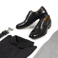Men's leather shoes and belt on a white background