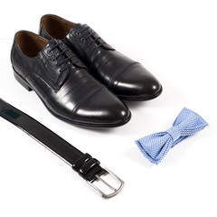 Set of male stylish clothes on white background, leather belt, shoes and bow tie