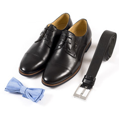 Set of male stylish clothes on white background, leather belt, shoes and bow tie