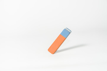 Eraser stands at an angle against a light background