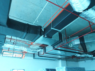 Installation of airconditioner ducting and chiller pipes system and hung it at the concrete slab....