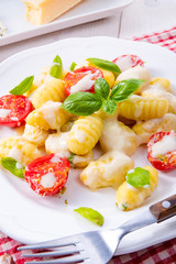 delicious gnocchi with gorgonzola cream sauce and cherry tomatoes