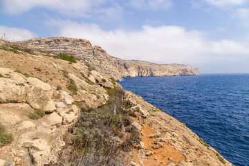 Fototapeta na wymiar Wied Iz-Zurrieq, Malta. Rocky coast in the southeast of the island
