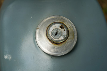 fuel tank inlet cover with key hole of vintage grey Japanese motorcycle