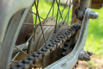 Dirty chain of vintage grey Japanese motorcycle
