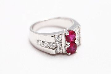 Pink gem stone on diamond ring