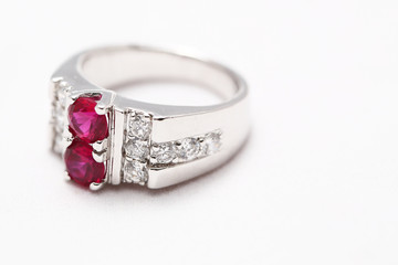 Pink gem stone on diamond ring