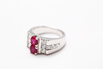 Pink gem stone on diamond ring