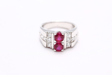 Pink gem stone on diamond ring