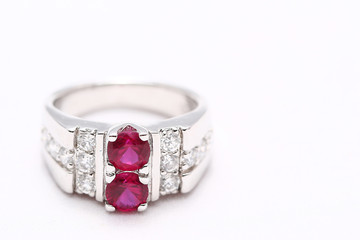 Pink gem stone on diamond ring